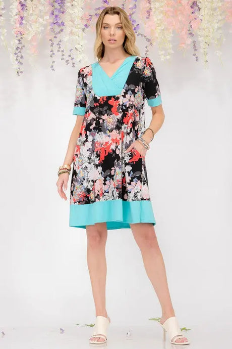 Celeste Full Size Floral Surplice Short Sleeve Dress with Pockets Plus Size | Hanalas